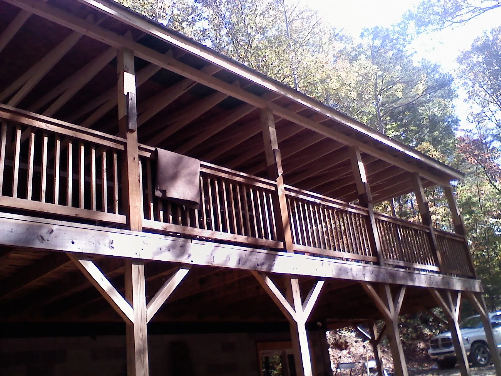 Timber framing under a new elevated porch and deck — Roof Leak Repair in Marcellus by Roofing Brothers